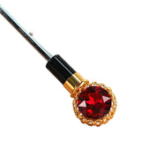 Glamur de medianoche: exclusivo paraguas negro adornado con un llamativo cristal rojo