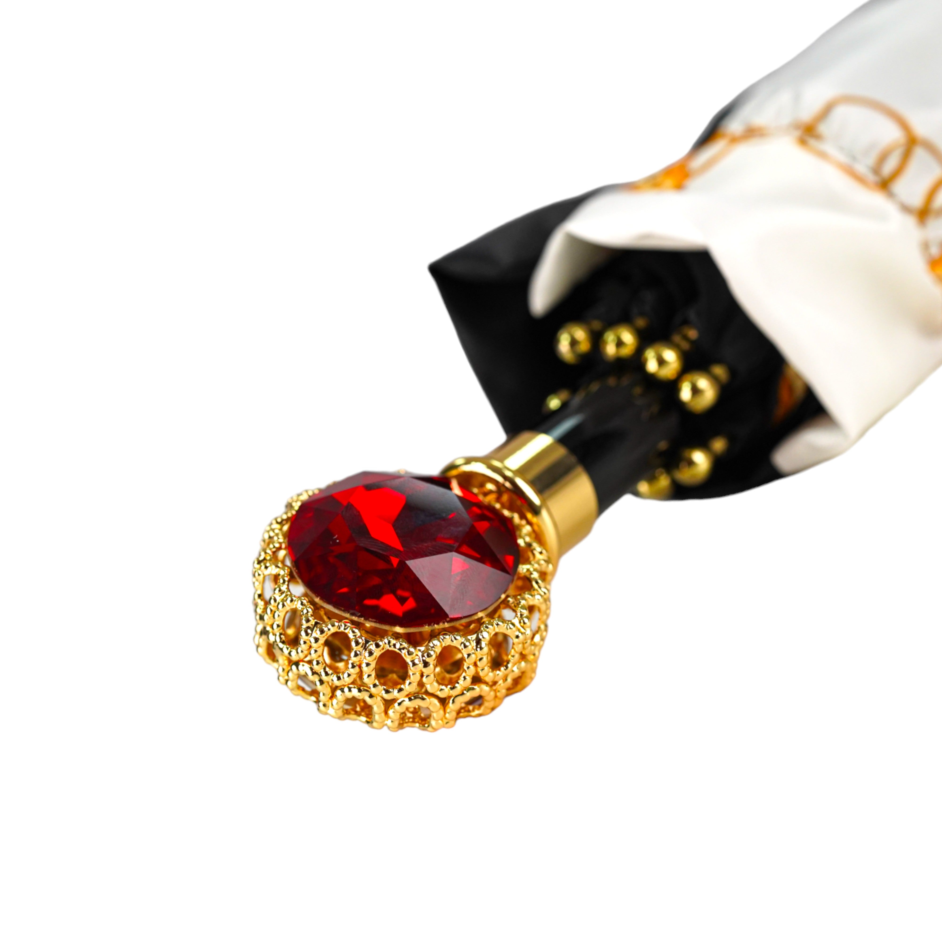 Glamur de medianoche: exclusivo paraguas negro adornado con un llamativo cristal rojo