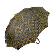 Paraguas elegante con mango de cuero, calavera dorada y un diseño de damasco negro y dorado ornamentado