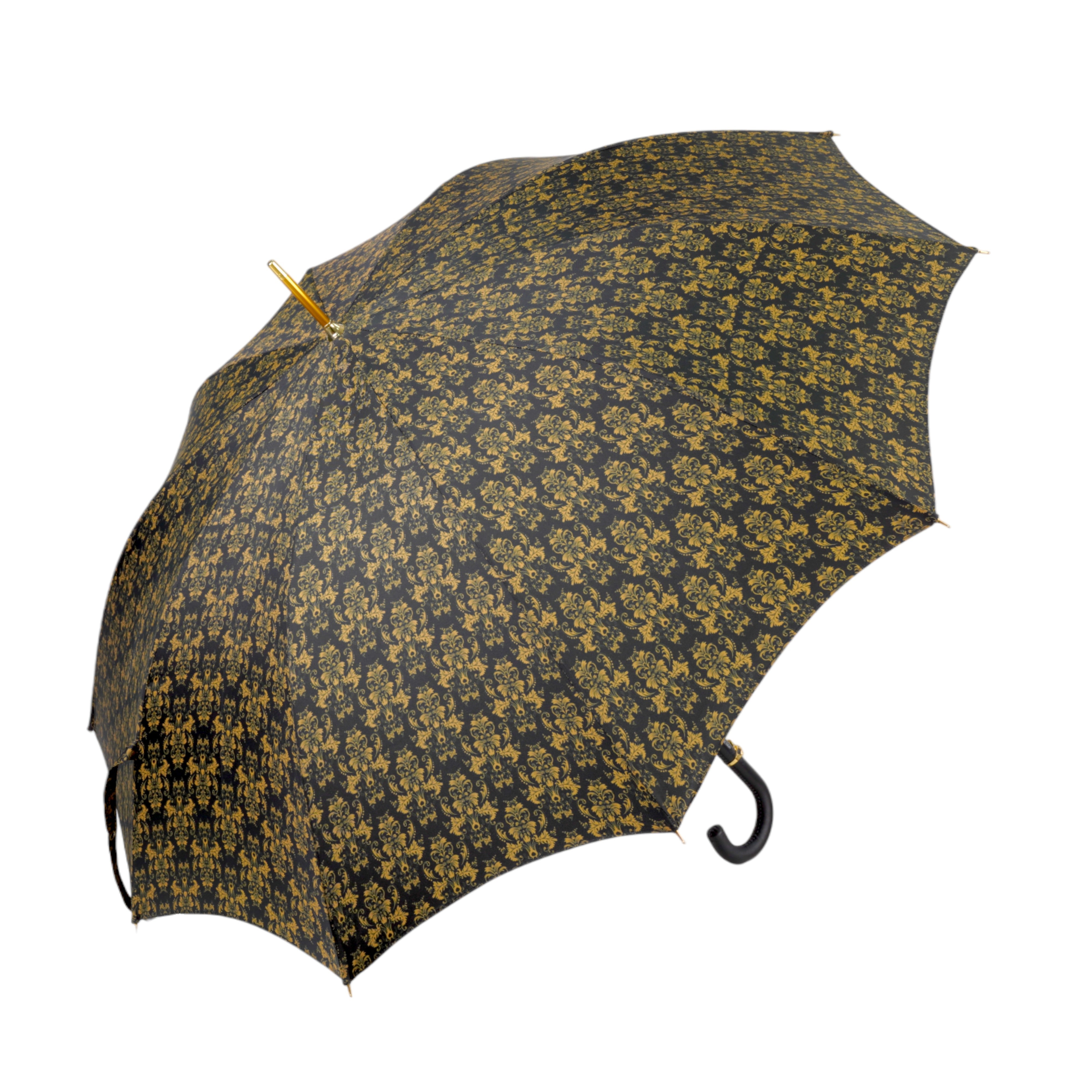 Paraguas elegante con mango de cuero, calavera dorada y un diseño de damasco negro y dorado ornamentado