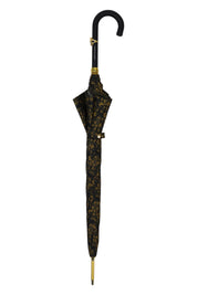 Paraguas elegante con mango de cuero, calavera dorada y un diseño de damasco negro y dorado ornamentado