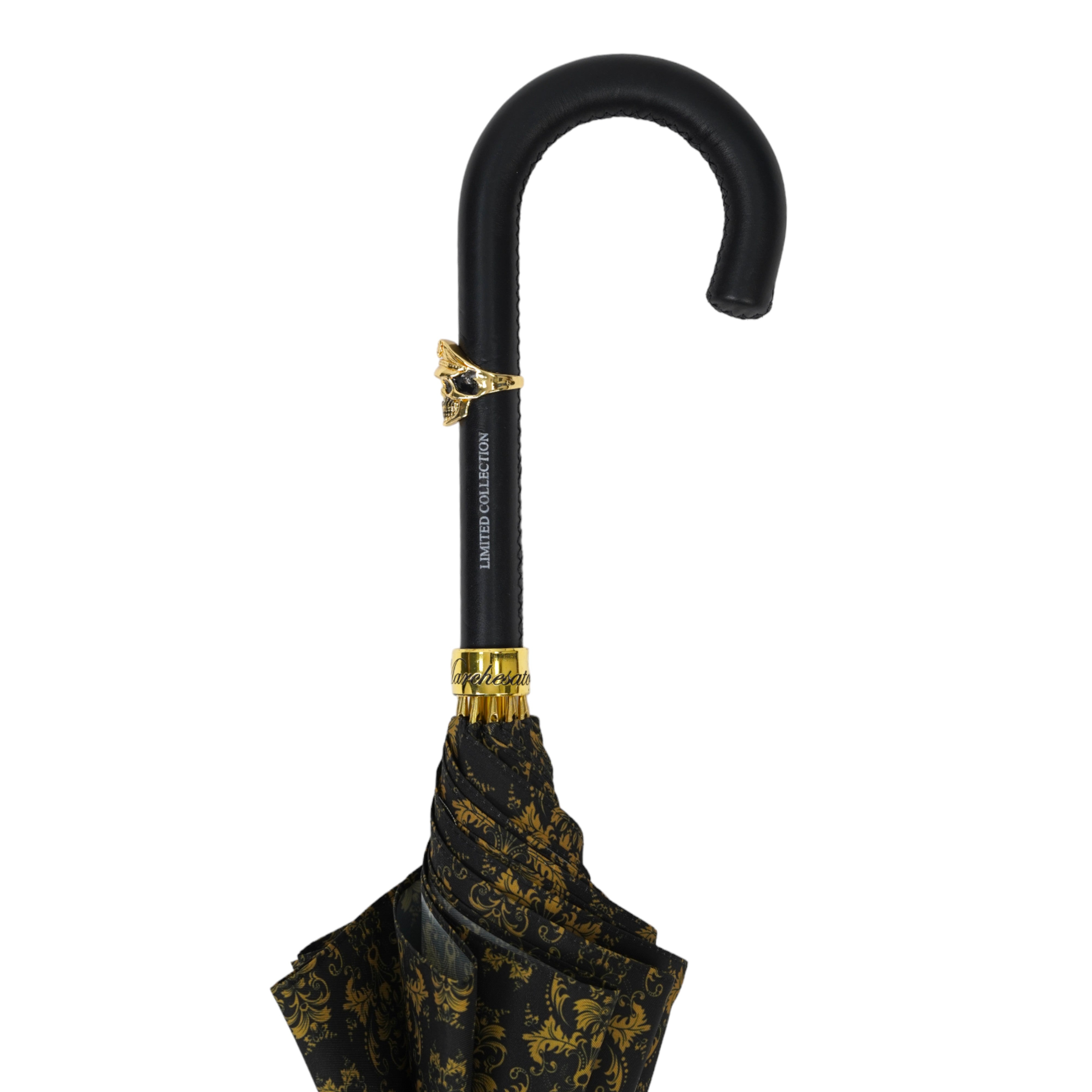 Paraguas elegante con mango de cuero, calavera dorada y un diseño de damasco negro y dorado ornamentado