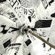 Read Between the Raindrops – The Newsprint Umbrella