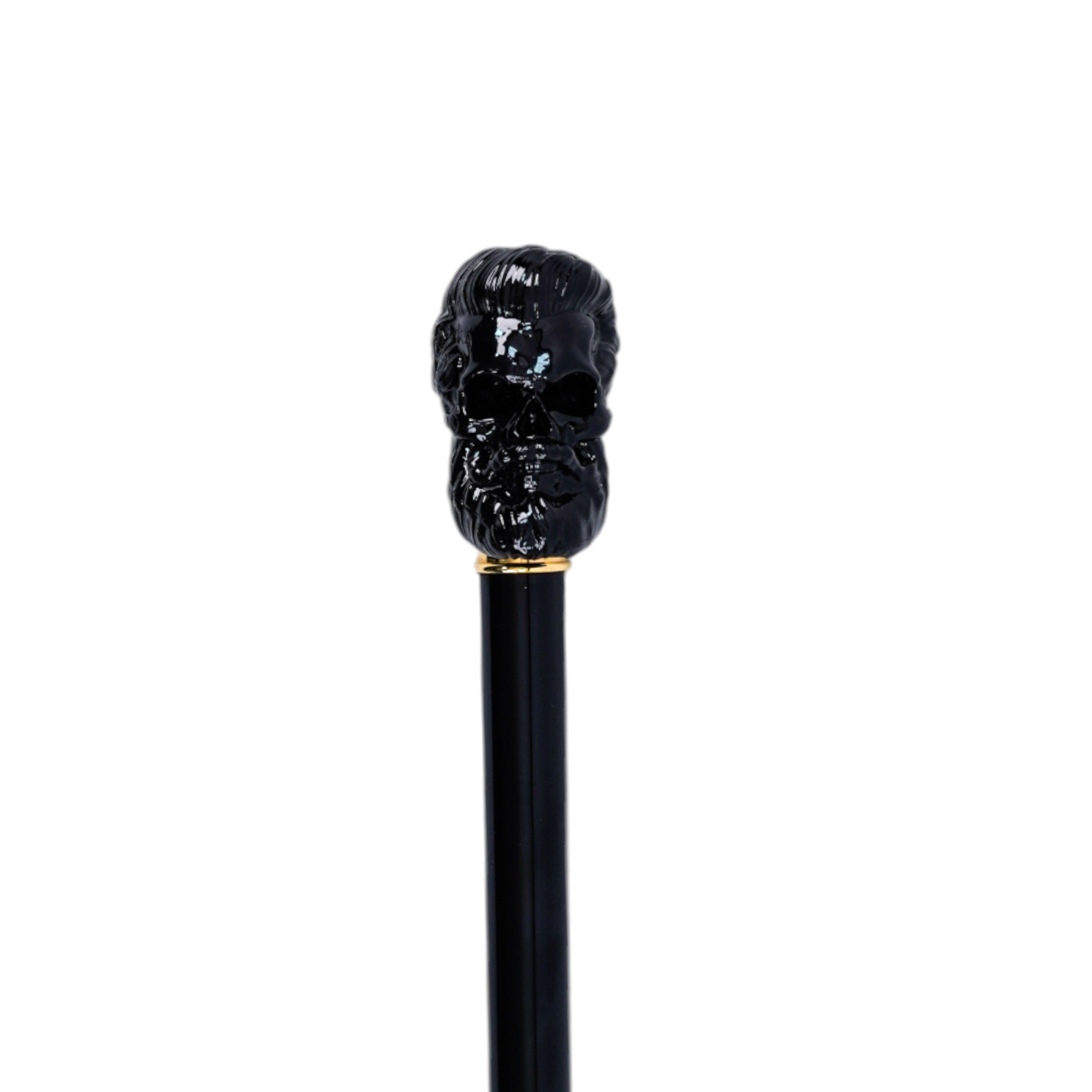 Bastón elegante con mango de calavera negra esculpida y detalles en oro