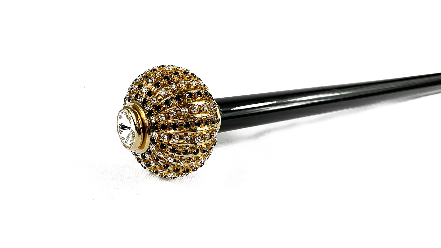 Walking stick with brass onion with black and white crystals